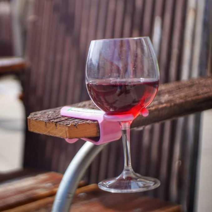 Pink wine hook on a wooden chair 