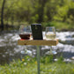 Hold your glass of wine outdoors while also holding your smartphone.  Speaker built in for backyard entertainment.